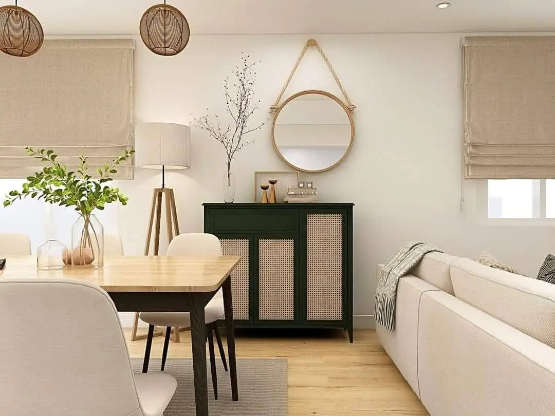 Dettaglio living con credenza verde foresta e specchio in corda